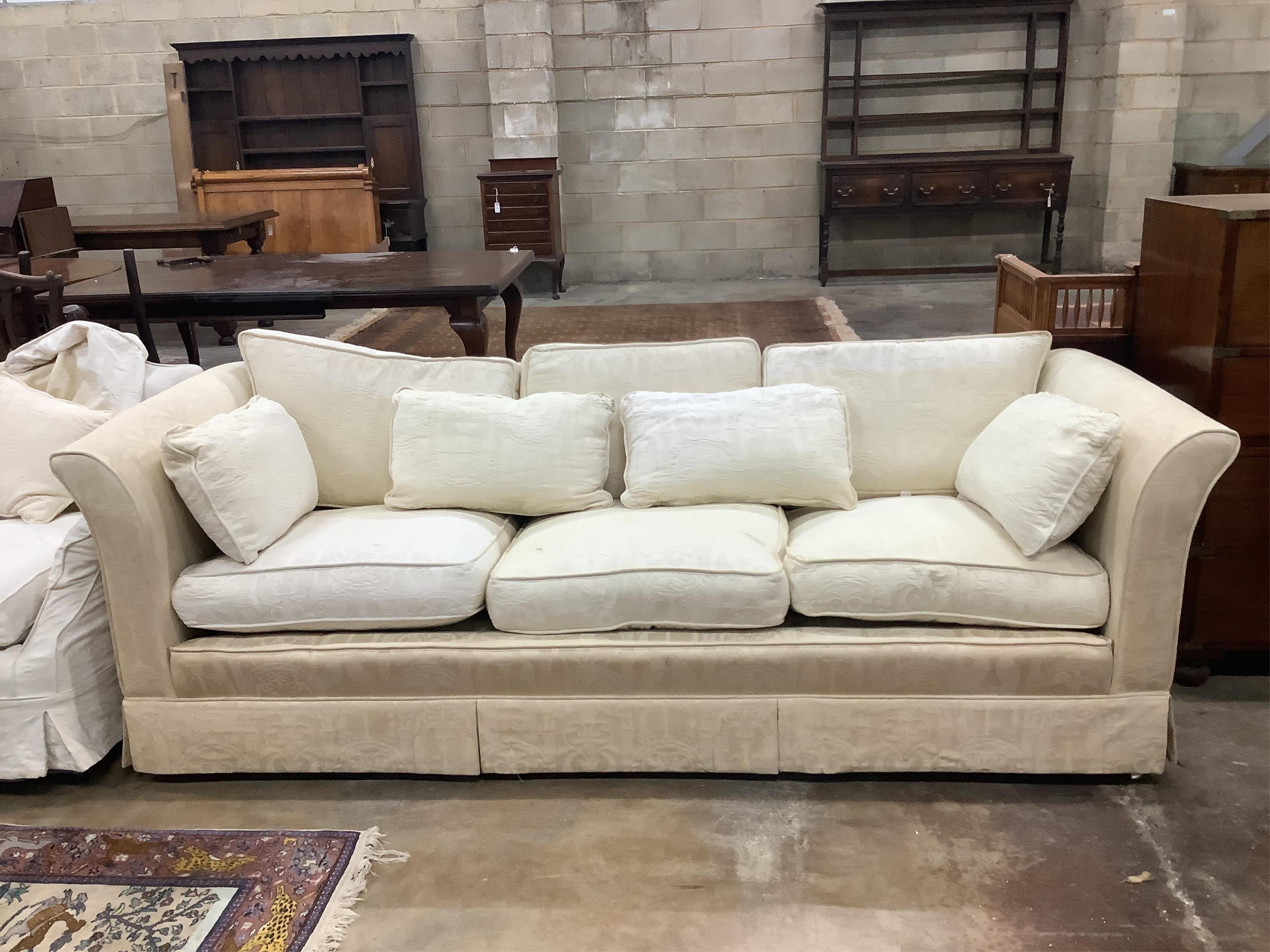 A pair of cream brocade upholstered three seater chesterfield settees, width 224cm, depth 91cm, height 72cm, and a matching lounge armchair. Condition - poor